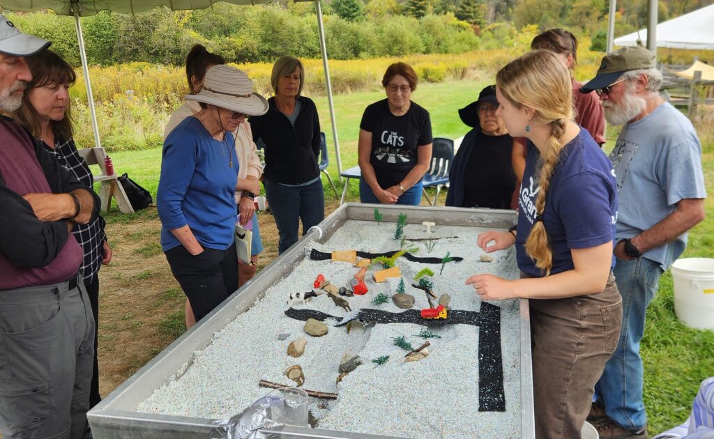 adult group at stream flume table